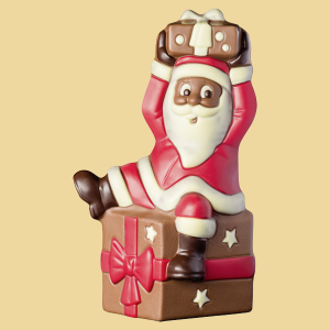 Weihnachtsmann auf Geschenk Schokoladefigur